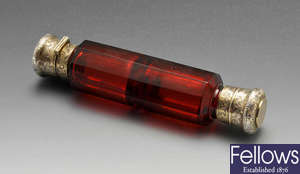 A late Victorian double-ended cranberry glass scent bottle by S. Mordan.