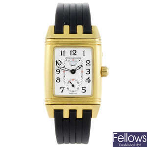 JAEGER-LECOULTRE - a lady's 18ct yellow gold Reverso wrist watch.