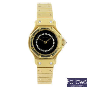 CARTIER - an 18ct yellow gold Santos bracelet watch.