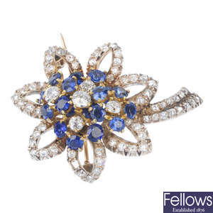 A diamond and sapphire floral brooch.