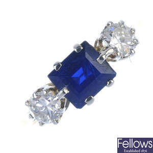 A mid 20th century 18ct gold and platinum sapphire and diamond three-stone ring.