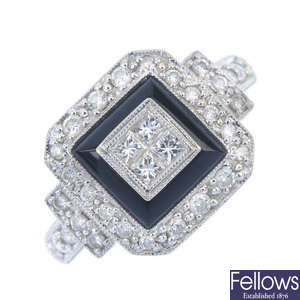 A diamond and onyx dress ring. 