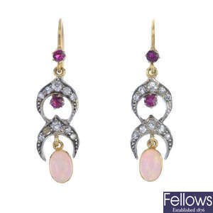 A pair of diamond, ruby and opal ear pendants.