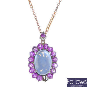 A moonstone and sapphire cluster pendant.