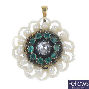 A diamond, emerald and seed pearl pendant. 