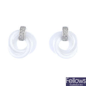A pair of diamond knot earrings.