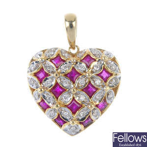 A ruby and diamond heart pendant.