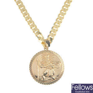 A 9ct gold St. Christopher pendant and two 9ct gold chains. 