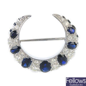 An 18ct gold sapphire and diamond crescent brooch.