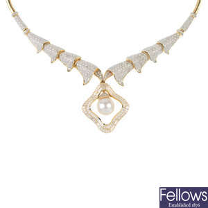 A diamond and and cultured pearl necklace.