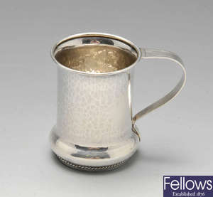A 1920's silver planished mug.
