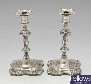 A pair of Edwardian silver tapersticks. 