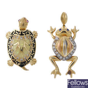 Two cubic zirconia and enamel novelty pendants.