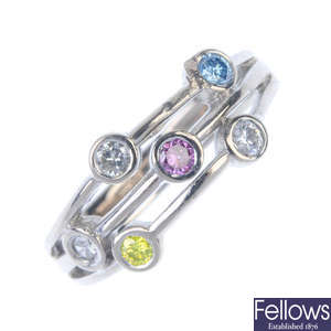 An 18ct gold diamond and colour treated diamond dress ring.