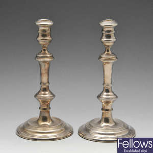 A pair of mid-20th century silver candlesticks.