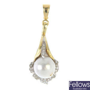A 1970s cultured pearl and diamond lily pendant.