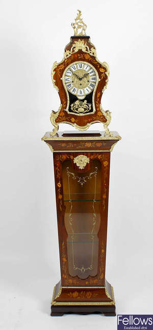 A modern Italian clock and pedestal cabinet. 