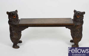 An unusual Black Forest carved wooden bench