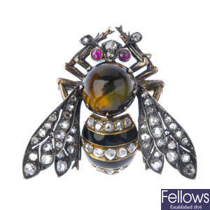 A late 19th century silver and 18ct gold tiger's-eye, enamel and diamond bee brooch.