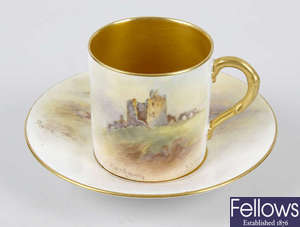 A Royal Worcester hand painted coffee cup and saucer