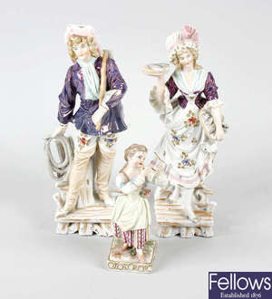 A box containing a small selection of various German porcelain figures
