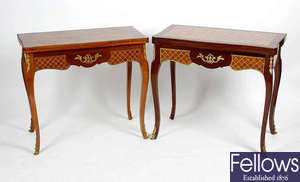 A matched pair of inlaid mahogany fold over card tables