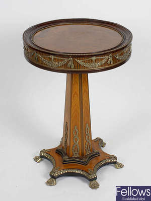 A French style brass mounted walnut and kingwood pedestal table