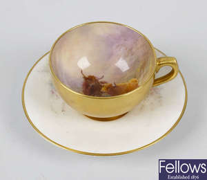 A Royal Worcester hand painted coffee cup and saucer