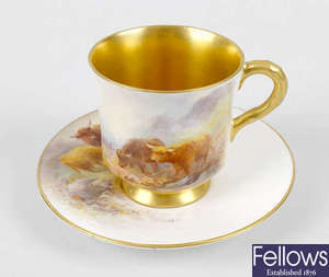 A Royal Worcester hand painted waisted cup and saucer