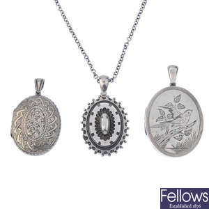 Three late Victorian silver lockets and a later chain.