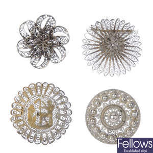 A selection of silver and white metal filigree jewellery.
