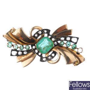 A mid 20th century emerald and diamond bow brooch.