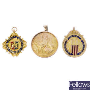 A selection of three early to mid 20th century 9ct gold medallion fobs.