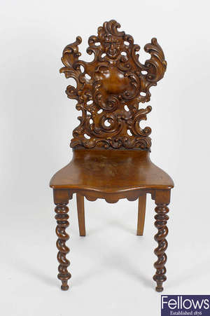 A 19th century carved fruitwood hall chair