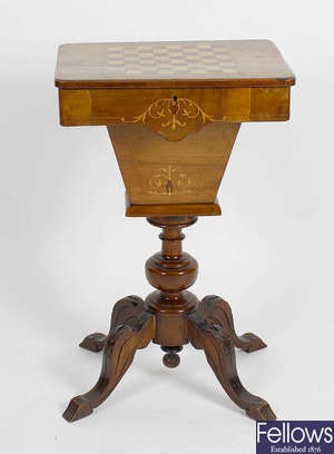 A Victorian inlaid walnut pedestal games/work table