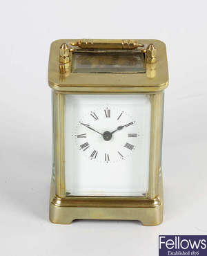 A late 19th century brass cased carriage clock style time piece with alarm