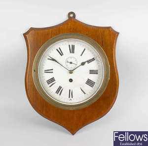 A late 19th century brass cased ships bulkhead style clock