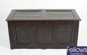  A 19th century oak coffer with panelled top and front 