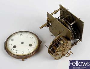 A box containing a good mixed selection of assorted clock movements and parts