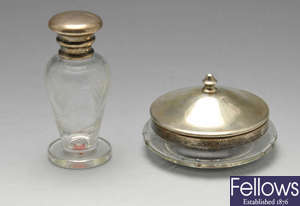 A George V silver mounted glass perfume bottle, plus a vanity jar. 
