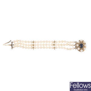 A cultured pearl three-strand bracelet.