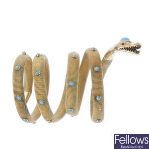 A turquoise coiled snake bracelet. 