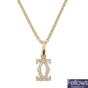 CARTIER - an 18ct gold diamond pendant. 