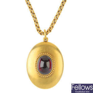 A late 19th century gold garnet pendant and chain.