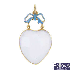 A late 19th century gold rock crystal enamel and quartz heart pendant.