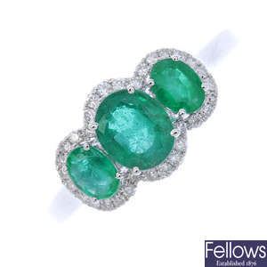 An 18ct gold emerald three-stone ring.