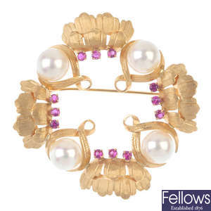 A ruby and cultured pearl floral wreath brooch.