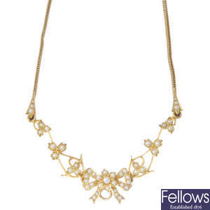 An early 20th century gold seed pearl floral necklace. 