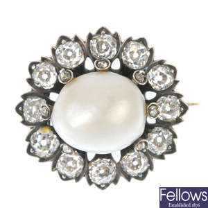 A late 19th century silver and gold natural pearl and diamond cluster brooch.