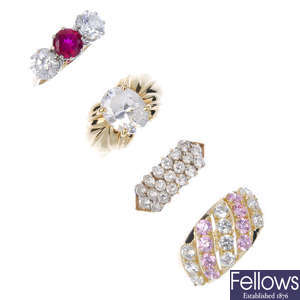 A selection of four 14ct gold gem-set dress rings.